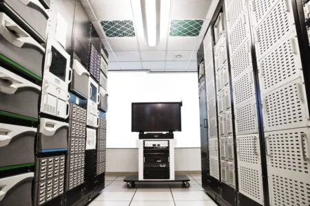 Storage racks aligned in a computer server room.